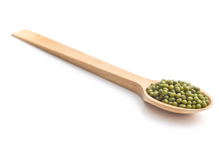 mung beans in wooden spoonの写真素材