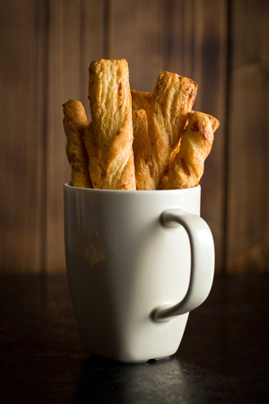 bread sticks with cheese in cupの写真素材