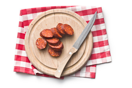sliced dried sausages on white backgroundの写真素材