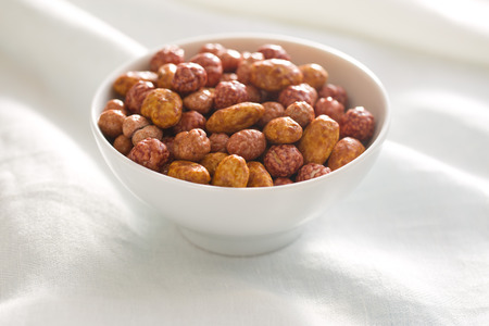 various sugared nuts in ceramic bowl