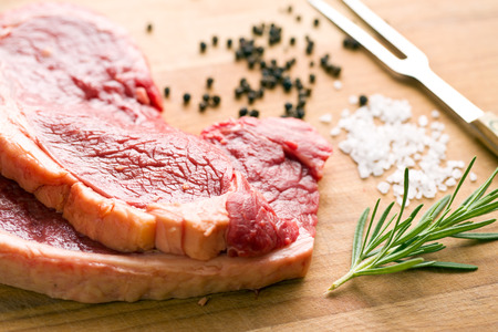 fresh raw beef on kitchen tableの写真素材