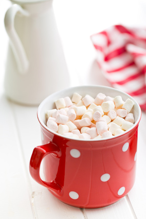 mini marshmallows in red mugの写真素材
