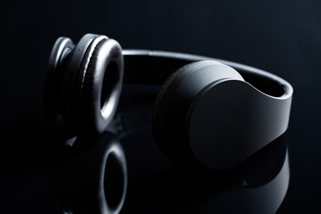 Wireless headphones on black backgroundの写真素材