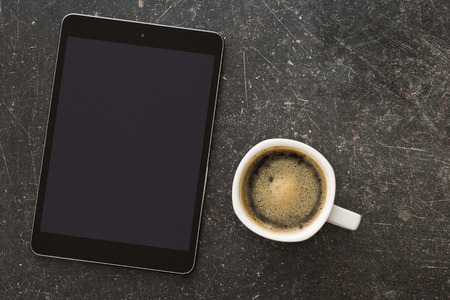 top view of coffee cup and computer tableの写真素材