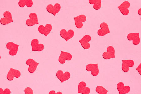 paper hearts on pink background