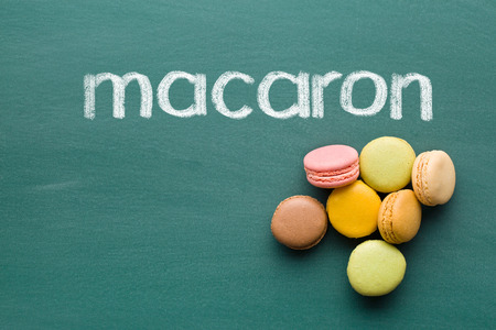sweet french macarons on chalkboardの写真素材