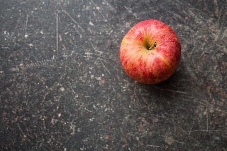 red autumn apple on old kitchen tableの写真素材