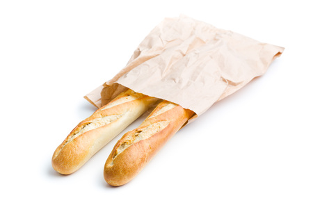 french baguettes in paper sack on white backgroundの写真素材
