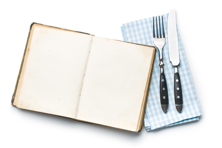 vintage book and cutlery on white backgroundの写真素材