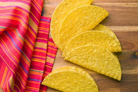 crispy taco shells on kitchen tableの写真素材