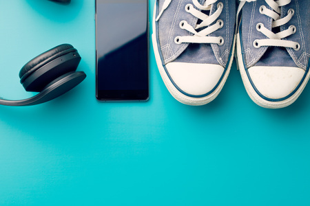 headphones, smart phone and sneakers on colorful backgroundの写真素材