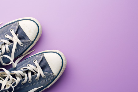 vintage sneakers on violet backgroundの写真素材