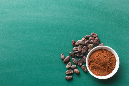 cocoa powder and cooa beans on chalkboardの写真素材