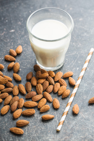 Almond milk and almonds. Tasty milk in glass.の写真素材