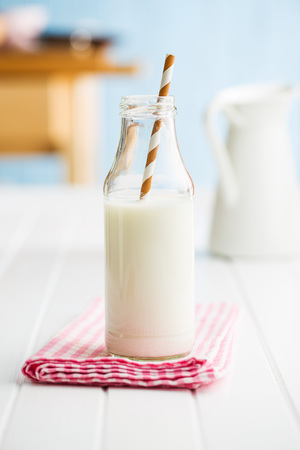 Fresh milk in glass bottle with straw.の写真素材