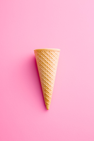 Sweet wafer cone on pink background.の写真素材