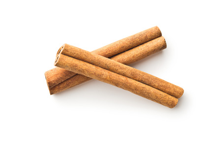 Cinnamon sticks isolated on white background. Top view.
