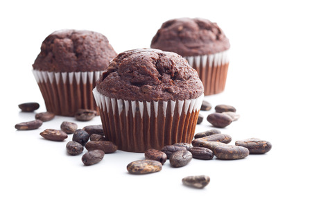 The tasty chocolate muffin and cocoa beans isolated on white background.の写真素材