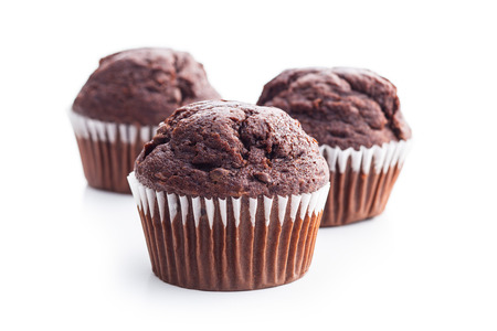The tasty chocolate muffin isolated on white background.の写真素材