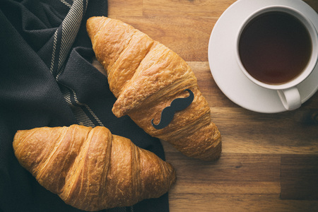 Father's day concept. Breakfast. Croissant with mustache.の写真素材