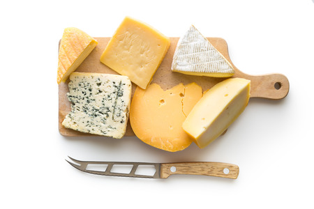 Different kinds of cheeses isolated on white background. Top view.の写真素材