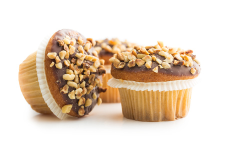Sweet hazelnut muffins isolated on white background.の写真素材