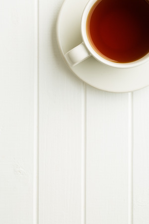 A cup of tea on white table. Top view.の写真素材