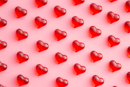 Hearts on pink a background. Top view.