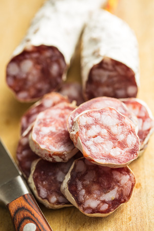 Tasty sliced salami with white mold.の写真素材