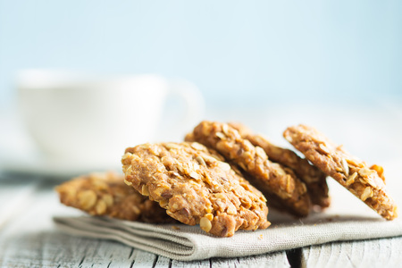 Homemade oatmeal cookies on old wooden table.の写真素材