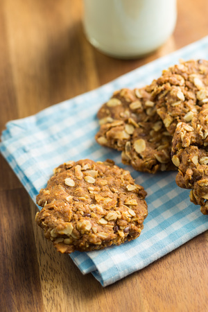 Homemade oatmeal cookies on wooden table.の写真素材