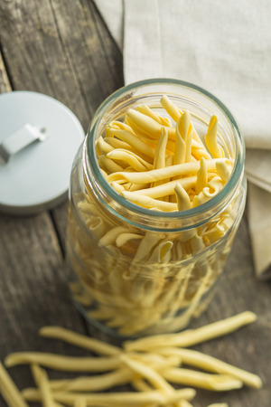 Raw italian pasta in jar.の写真素材
