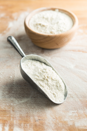 The wheat flour in metal scoop.の写真素材