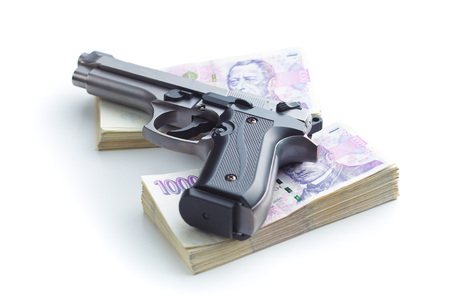 Handgun and czech paper money.の写真素材