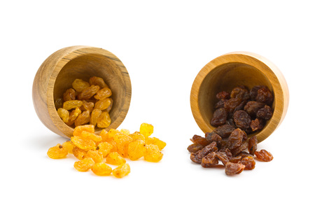 Sweet dried raisins in bowl isolated on white background.の写真素材