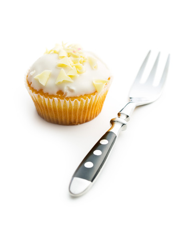 Tasty cupcake and fork isolated on white background.の写真素材