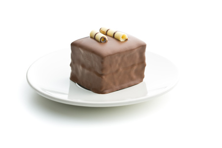 Sweet chocolate dessert on dessert plate isolated on white background.の写真素材