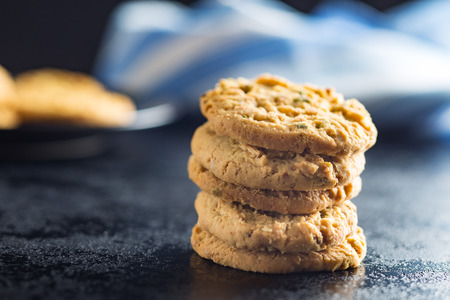 Sweet pistachio cookies on black table.の写真素材