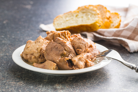 Cod liver in oil on plate.