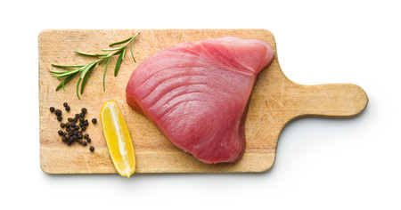 Fresh raw tuna steak on cutting board.の写真素材
