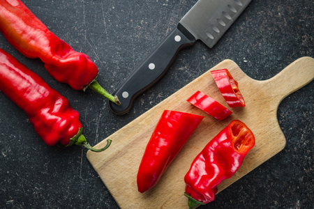 Sliced red pepper on cutting board.の写真素材