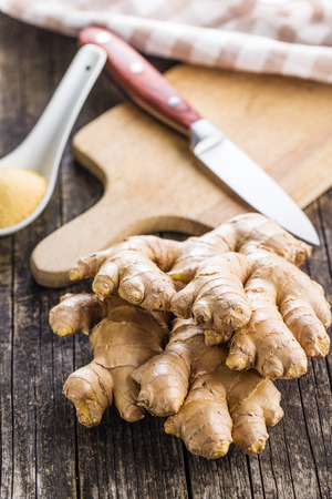 Healthy ginger root on old wooden table.の写真素材