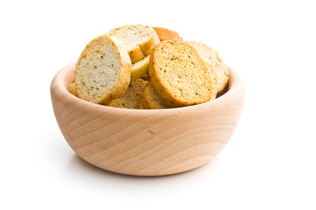 Crusty bread bruschetta in wooden bowl isolated on white background.の写真素材