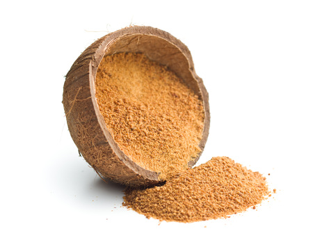 Sweet coconut sugar in coconut shell isolated on white background.の写真素材