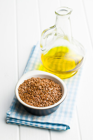 Healthy brown linseeds and oil.の写真素材
