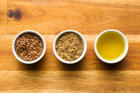 Healthy brown linseeds, minced linseed and oil.の写真素材