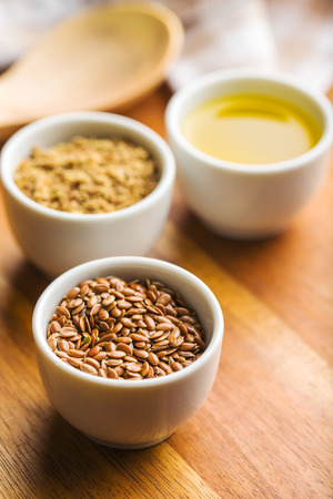 Healthy brown linseeds, minced linseed and oil.の写真素材