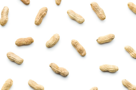 The unpeeled peanuts isolated on white background.の写真素材