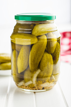 Pickles in bowl. Tasty preserved cucumbers in jar.の写真素材