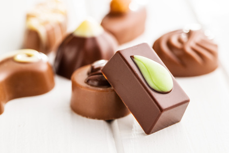 Mixed belgian pralines. Chocolate truffles on white table.の写真素材